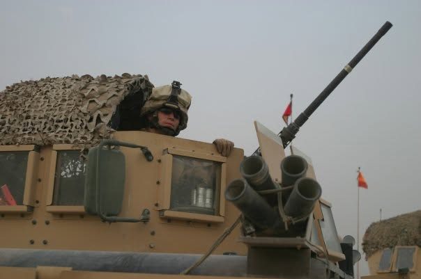 Sergeant Jordan Cervi, U.S. Marine Corps, in a vehicle turret during deployment